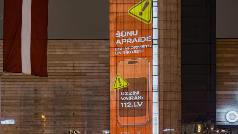 Kampaņas vizuālis uz Origo ēkas